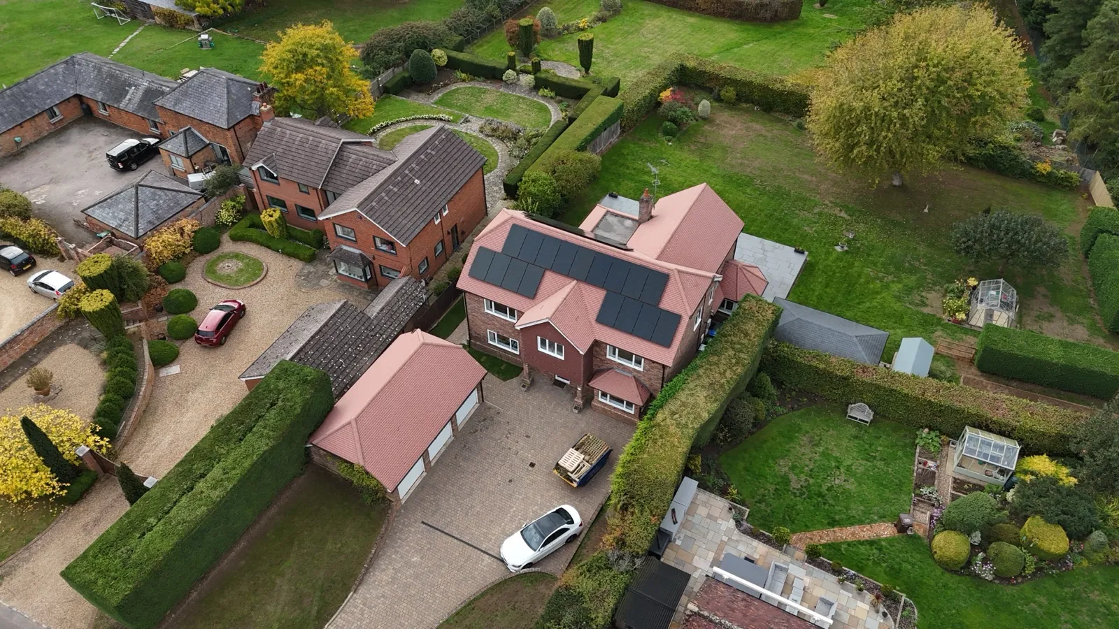 Solar arrays on a Bedfordshire farm building roof, aerial view